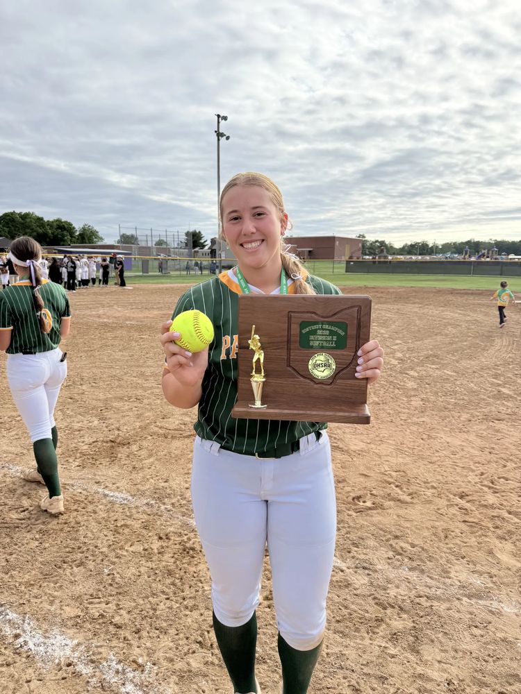 Abigail with the 2026 District Champions softball plaque