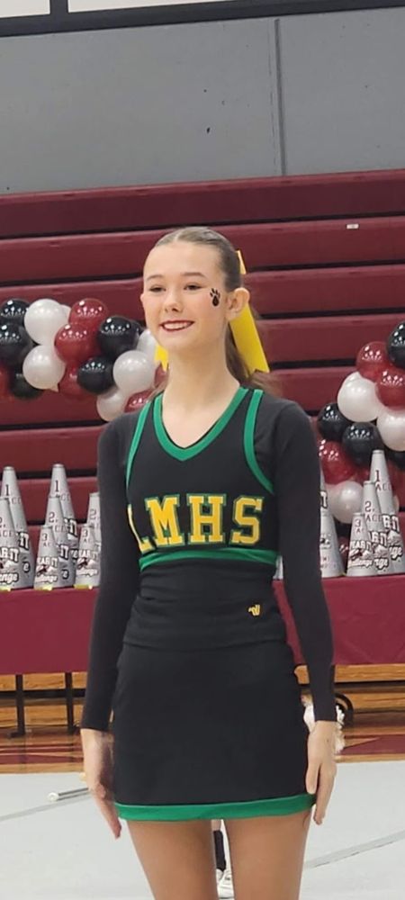 Emmalyn in her Little Miami competition cheer uniform