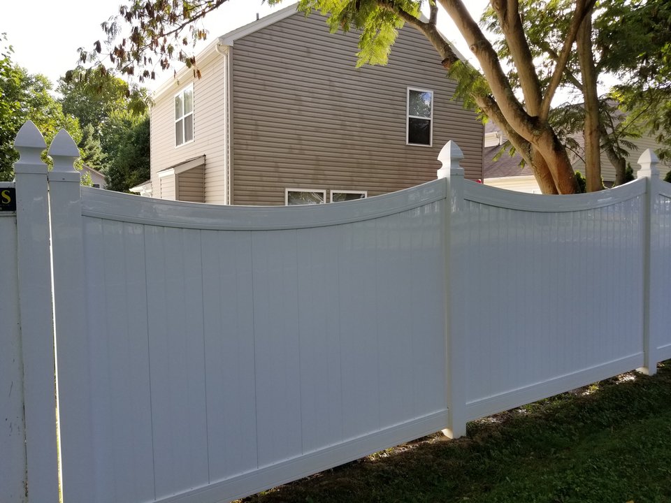 The same vinyl fence panels restored to a clean white finish after soft washing by Osborne Pro Wash
